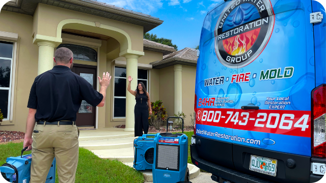 United-water-restoration-technician-greets-customer
